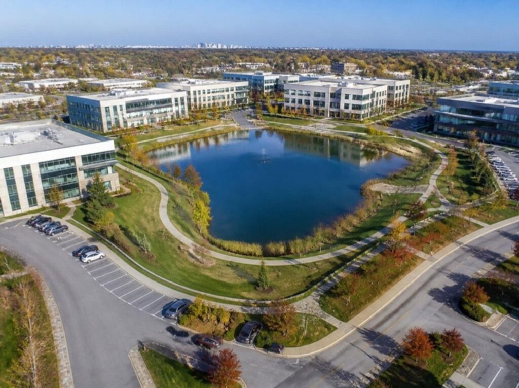 Business park office buildings around a lake in Glenview, IL, Glenview office space guide for tenants | Tenant Advisors