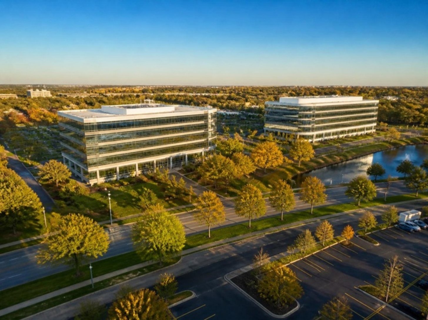 Office buildings along a tree-lined parkway in Deerfield, IL, Deerfield office space guide for tenants | Tenant Advisors